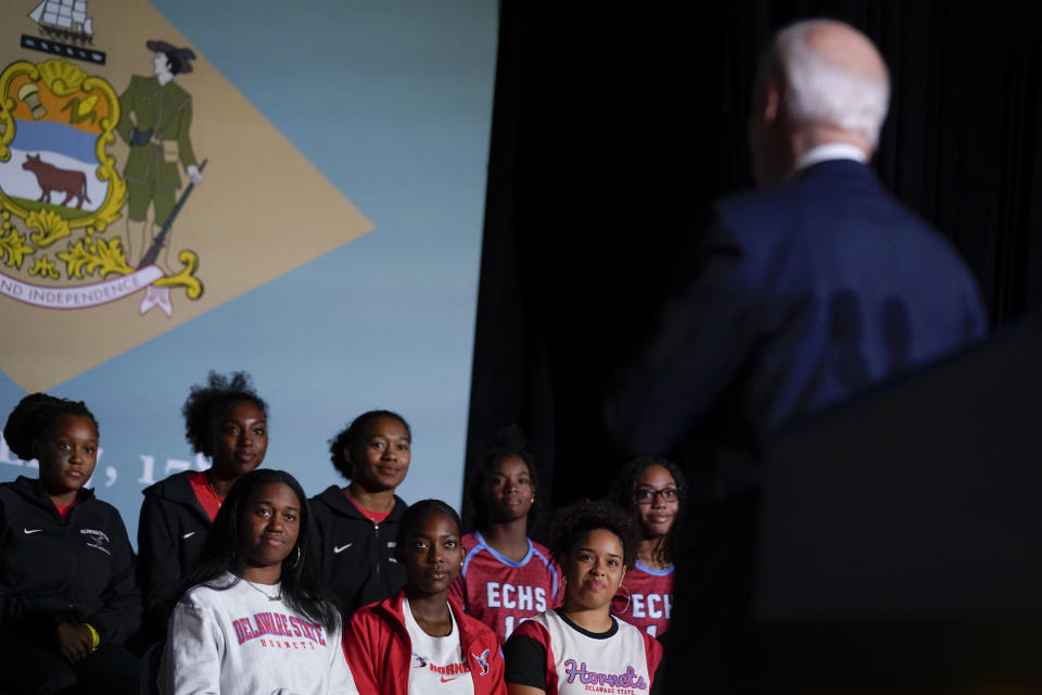 FILE - President Joe Biden looks to Delaware State University students as he speaks about student loan debt relief at the university on Oct. 21, 2022, in Dover, Del. The oldest president in American history, Joe Biden would be 86 by the end of his second term, should he win one. He’ll nonetheless need young voters to back him next year as solidly as those under 30 did in 2020, when they supported Biden over his predecessor, Donald Trump, by a 61% to 36% margin, according to AP VoteCast. (AP Photo/Evan Vucci, File)