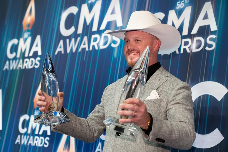 Cody Johnson poses with his awards for music video and single of the year.