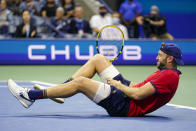 Jack Sock reacts to an injury during a match with Germany's Alexander Zverev during the third round of the US Open tennis championships, Saturday, Sept. 4, 2021, in New York. Zverev won the match after Sock withdrew with an injury. (AP Photo/Frank Franklin II)