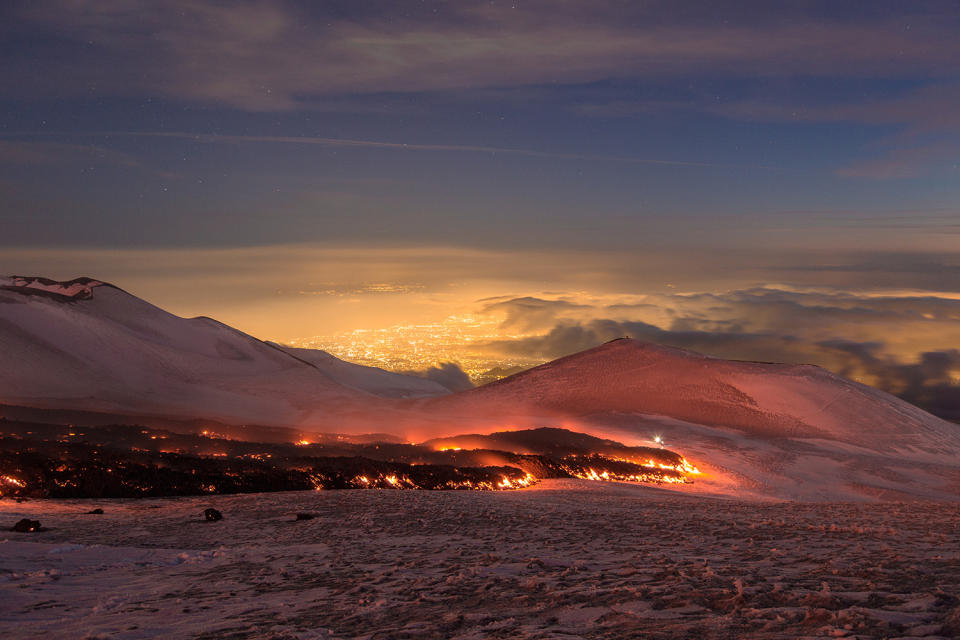 <p>Mount Etna, Europe’s most active volcano, spews lava during an eruption, near the Sicilian town of Catania, southern Italy, Tuesday, Feb. 28, 2017. (Marco Restivo/Barcroft Images/Barcroft Media via Getty Images) </p>