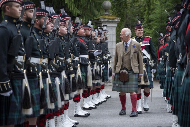 The King inspects a row of troops