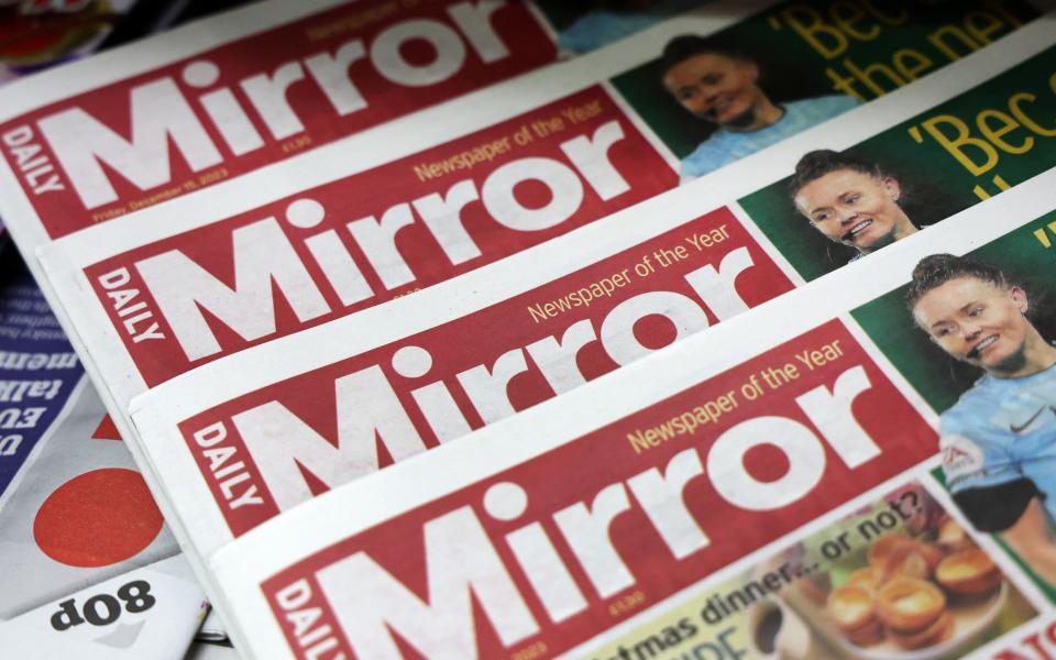 Copies of The Daily Mirror newspapers are displayed at a store in London today