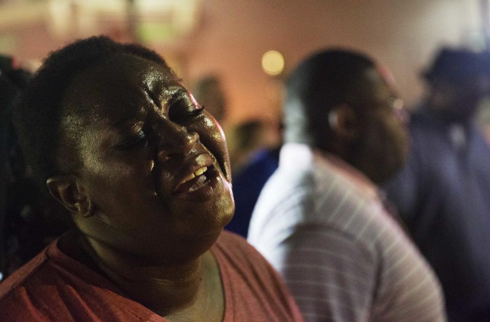 Lisa Doctor joins a prayer circle down the street from the Emanuel AME Church early Thursday, June 18, 2015 following a shooting Wednesday night in Charleston, S.C. (AP Photo/David Goldman)