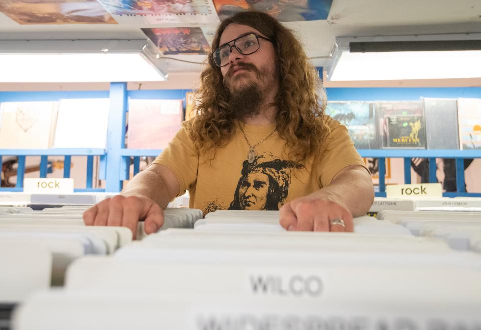 JL Records employee Hunter Butler shares his memories of the late owner Jim Pasdach. Photo taken, Thursday, July 20, 2023, at JL Records in West Lafayette, Ind. 