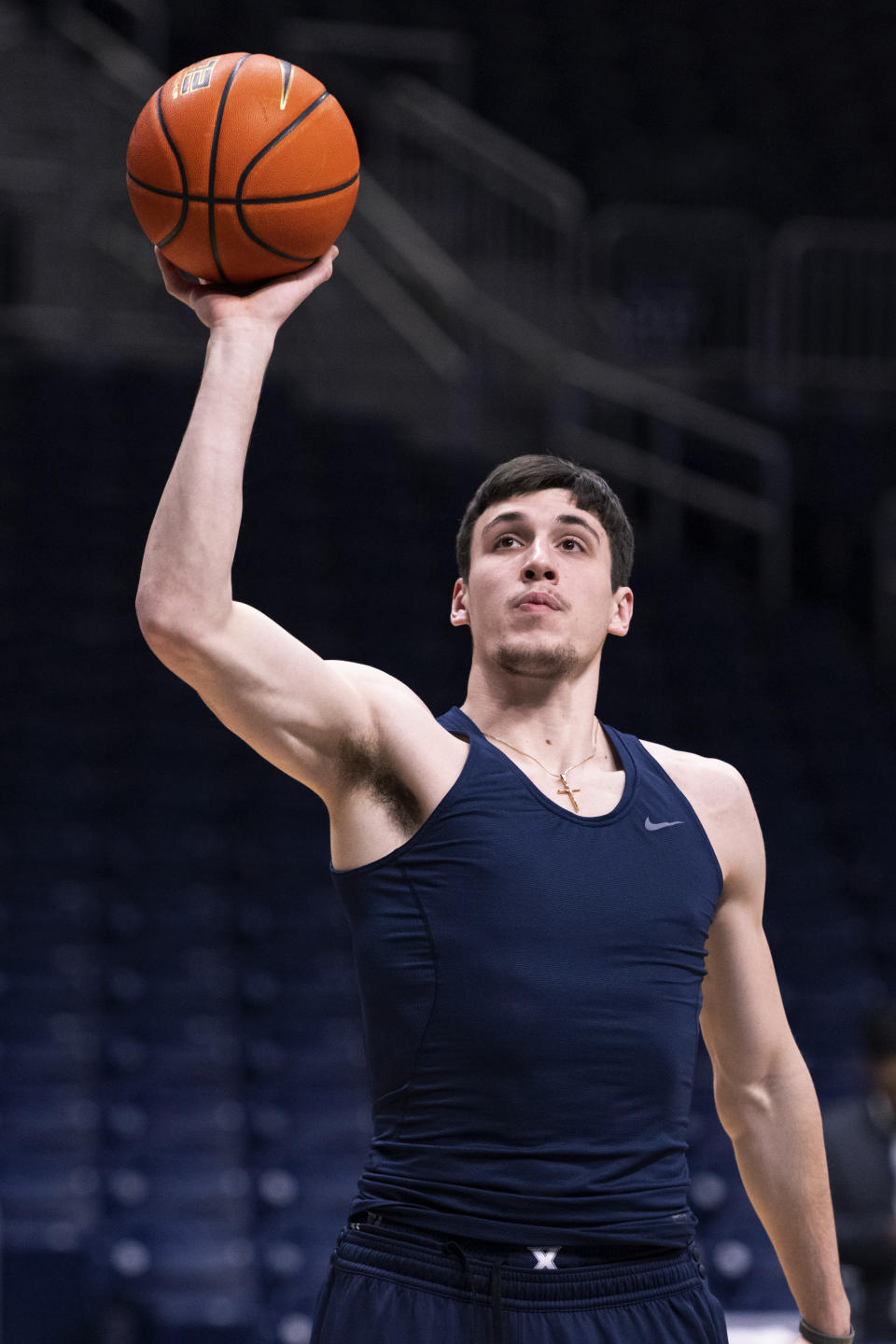 Xavier forward Zach Freemantle warms up for the team's NCAA college basketball game against Butler, Friday, Jan. 7, 2022, in Indianapolis. (AP Photo/Doug McSchooler)