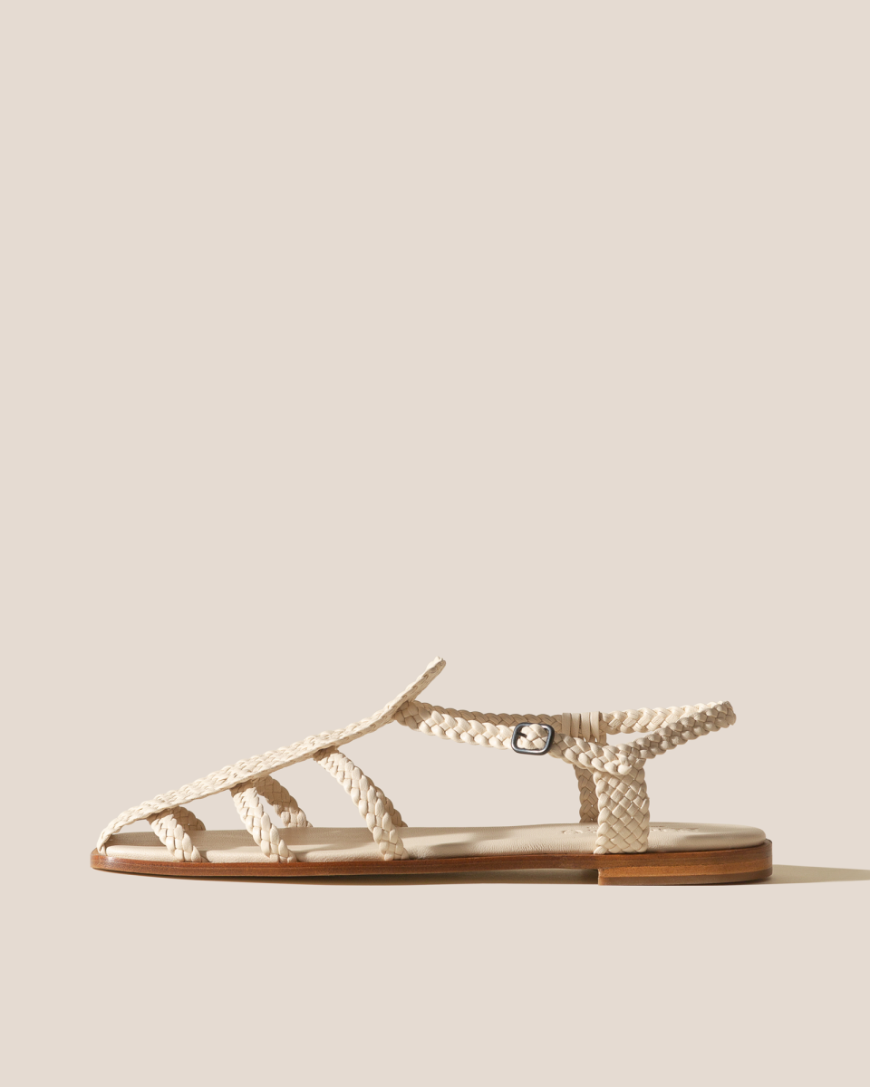 <p><a href="https://hereustudio.com/products/galdana-woven-sandal-ivory" rel="nofollow noopener" target="_blank" data-ylk="slk:Shop Now;elm:context_link;itc:0;sec:content-canvas" class="link ">Shop Now</a></p><p>Galdana Sandal</p><p>hereustudio.com</p><p>€490.00</p><span class="copyright">HereU</span>