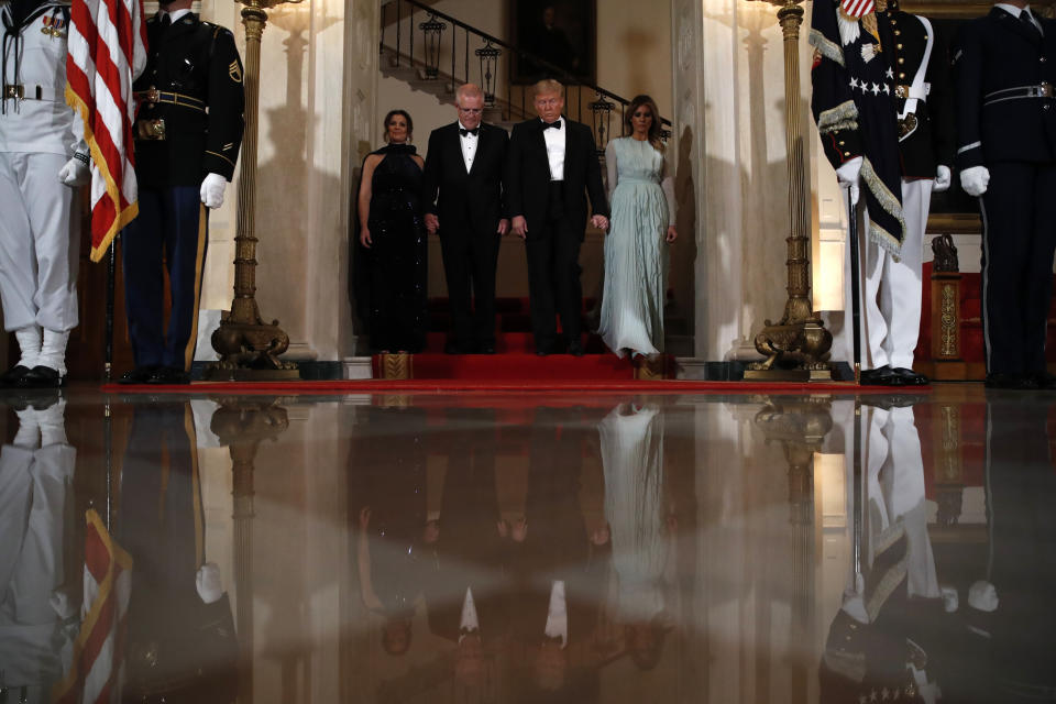 President Donald Trump and first lady Melania Trump stand with Australian Prime Minister Scott Morrison and his wife Jenny Morrison as they arrive for a State Dinner at the White House, Friday, Sept. 20, 2019, in Washington. (AP Photo/Alex Brandon)