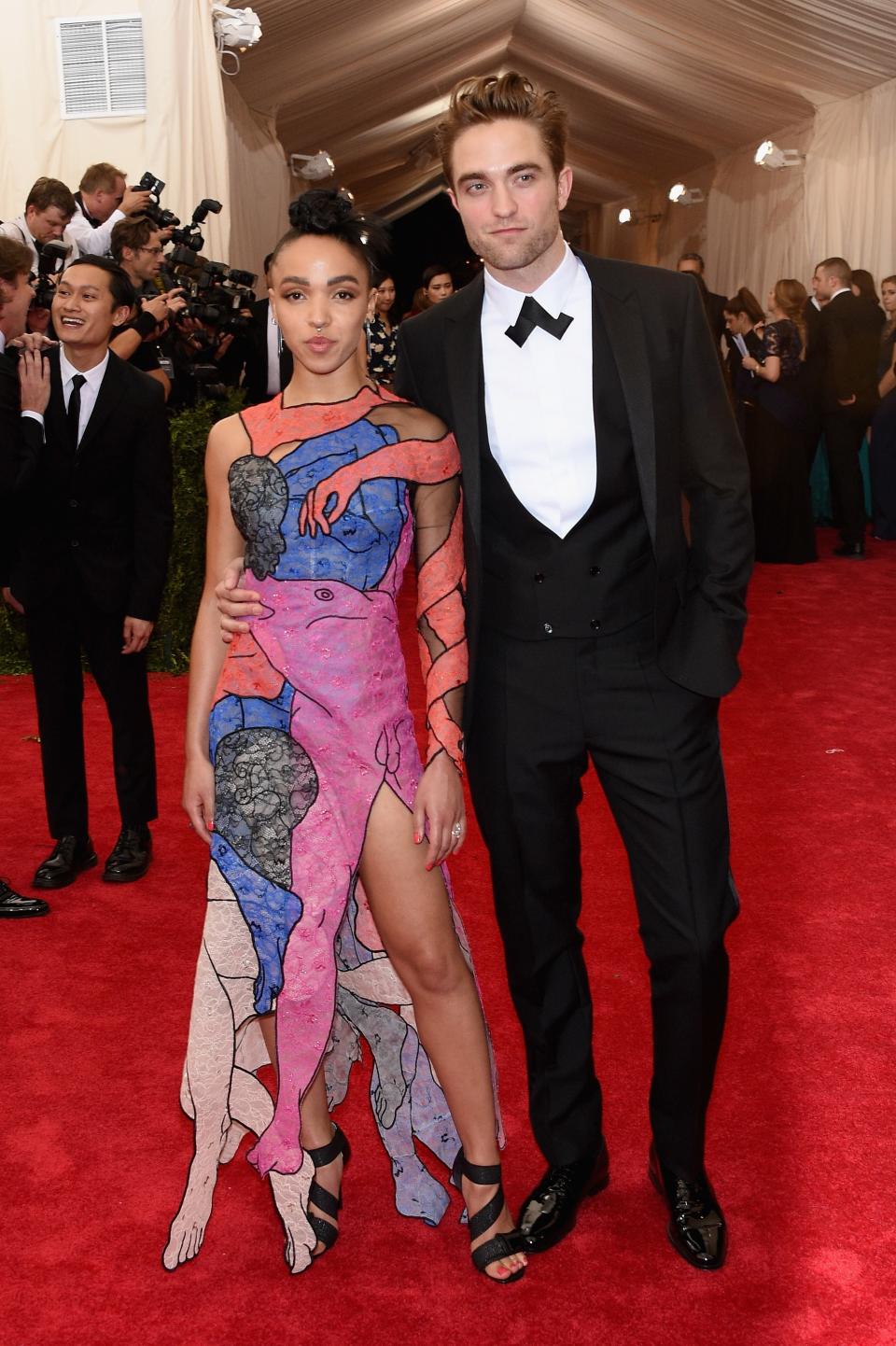 <h1 class="title">FKA twigs in Christopher Kane and Lynn Ban jewelry and Robert Pattinson in Dior Homme</h1><cite class="credit">Photo: Getty Images</cite>