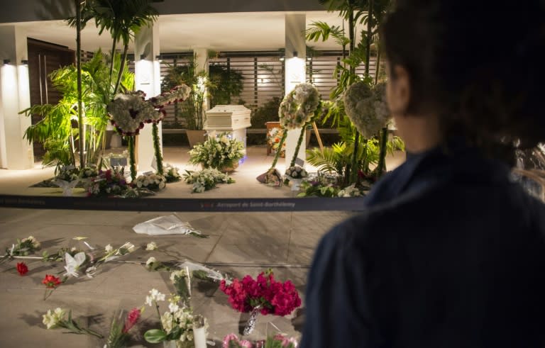 Residents and fans view the coffin of Johnny Hallyday in St Barts where the French singer will be buried