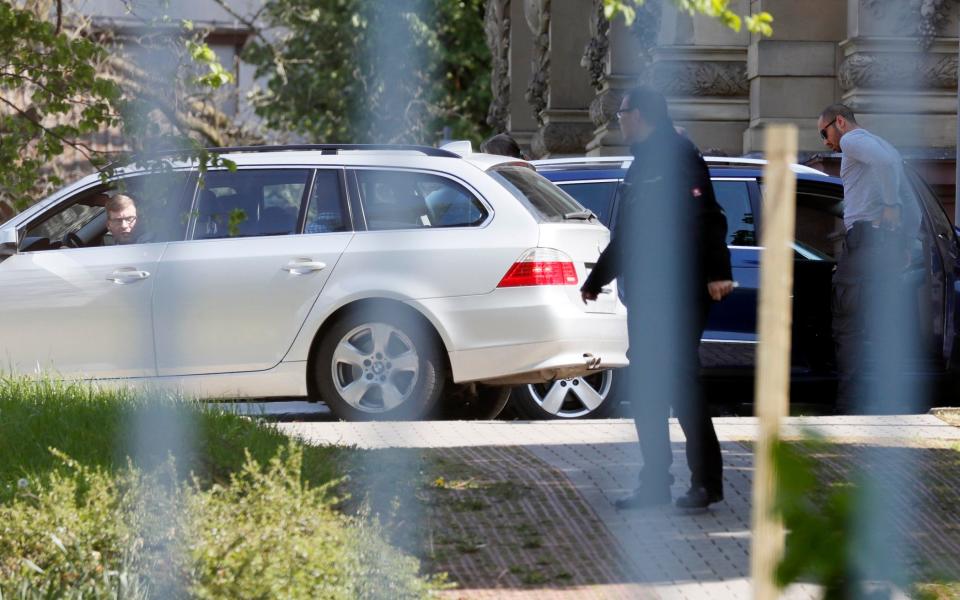 Police cars transport the arrested suspect of the bombing attack on team bus of Borussia Dortmund for his arraignment to German Federal High Court of Justice in Karlsruhe, Germany, April 21 - Credit: RONALD WITTEK/EPA