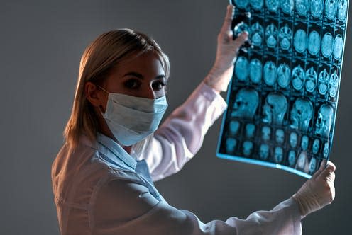   <span class="attribution"><a class="link " href="https://www.shutterstock.com/image-photo/female-doctor-mask-examines-xray-mri-1721281114" rel="nofollow noopener" target="_blank" data-ylk="slk:Orion Production/Shutterstock;elm:context_link;itc:0;sec:content-canvas">Orion Production/Shutterstock</a></span>