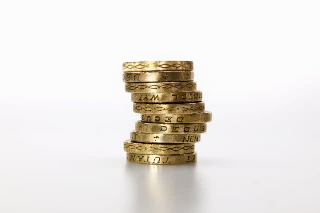 10 pound coins stacked in a pile