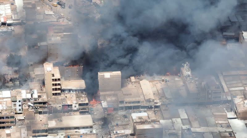 A view of black smoke and fire at Omdurman market