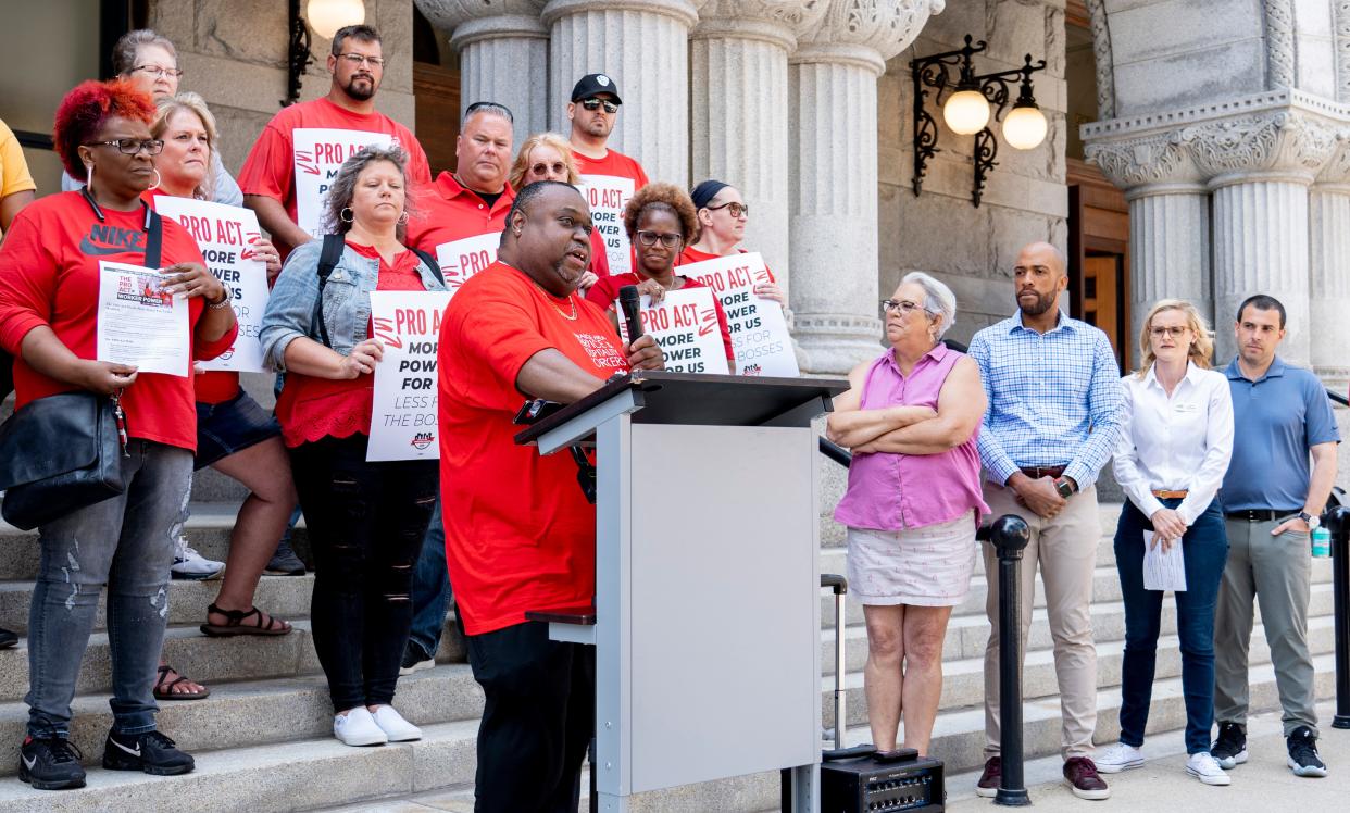 Troy Brewer, a union worker at the Fiserv Forum, speaks at a rally and press conference hosted by the Communications Workers of America (CWA) to call on lawmakers to vote for the Protect the Rights to Organize (PRO) Act. on Wednesday at the U.S. Courthouse & Federal Office Building in Milwaukee. Democratic U.S. Senate candidates Mandela Barnes (third from right), Sarah Godlewski and Alex Lasry joined the rally