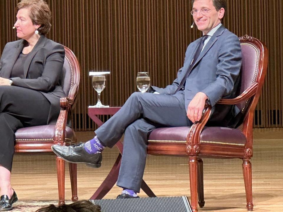 Peter Baker of The New York Times (right), appearing with Susan Glasser of The New Yorker, wore purple socks in honor of longtime CBS News reporter and anchor Bob Schieffer for the Schieffer Symposium on Tuesday, Nov. 8, 2023 at TCU.