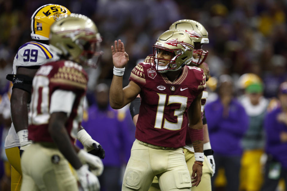 NEW ORLEANS, LOUISIANA - SEPTEMBER 04: Quarterback Jordan Travis #13 of the Florida State Seminoles reacts after a touchdown against the LSU Tigers at Caesars Superdome on September 04, 2022 in New Orleans, Louisiana. (Photo by Chris Graythen/Getty Images)