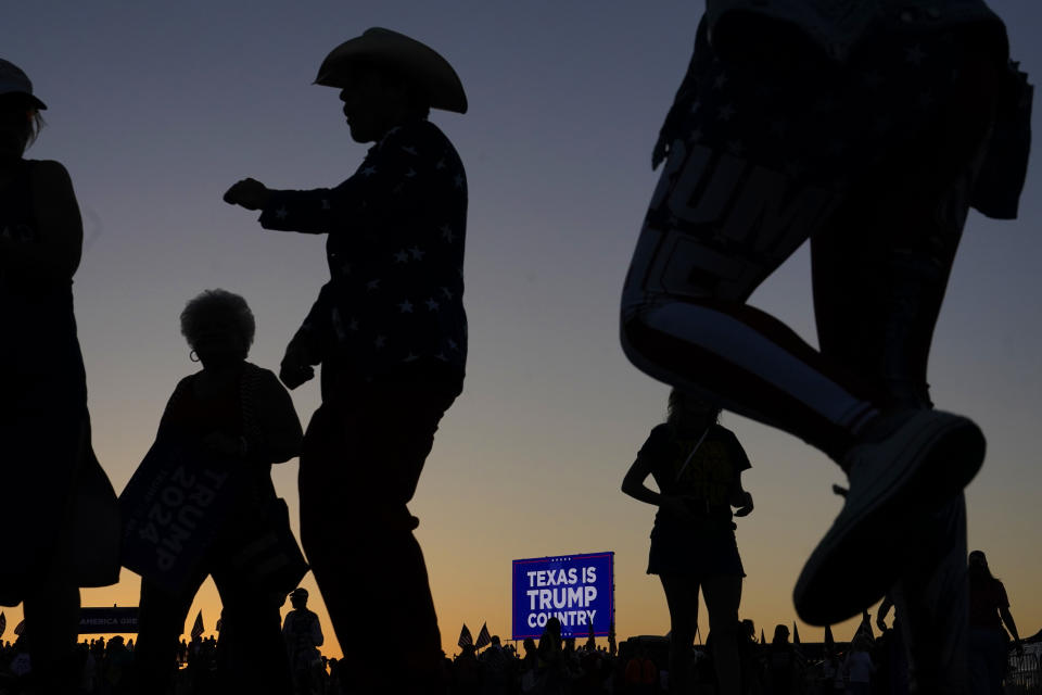 Supporters dance after former President Donald Trump spoke at a campaign rally at Waco Regional Airport Saturday, March 25, 2023, in Waco, Texas. (AP Photo/Nathan Howard)