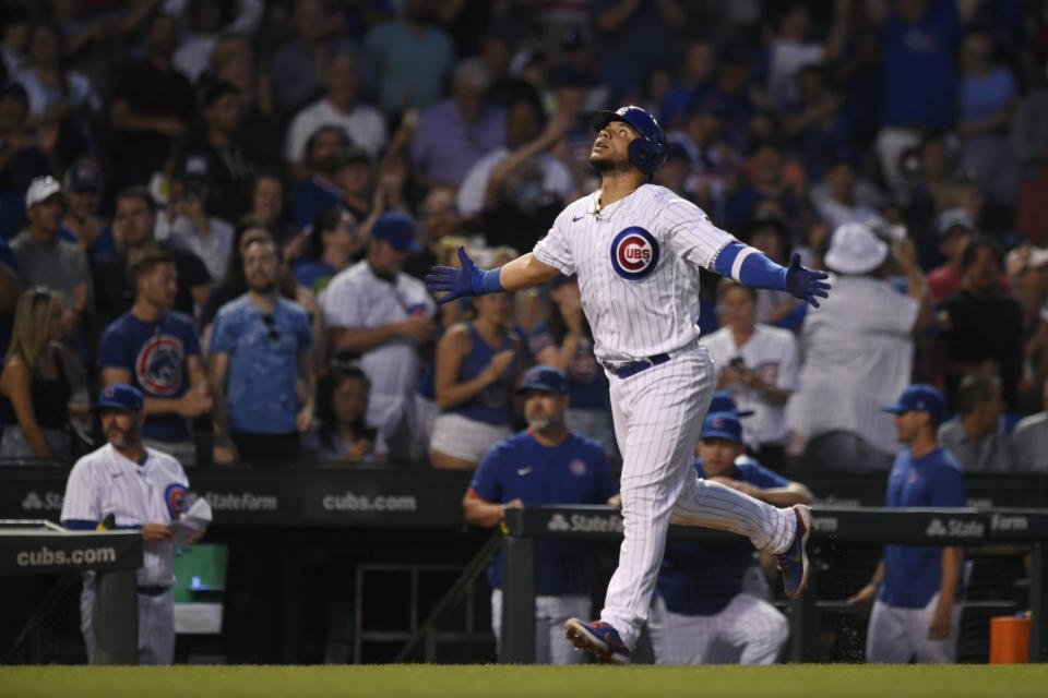 Chicago Cubs' Willson Contreras celebrates while running the bases after hitting a two-run home run during the fifth inning of the team's baseball game against the Cincinnati Reds on Wednesday, June 29, 2022, in Chicago. (AP Photo/Paul Beaty)