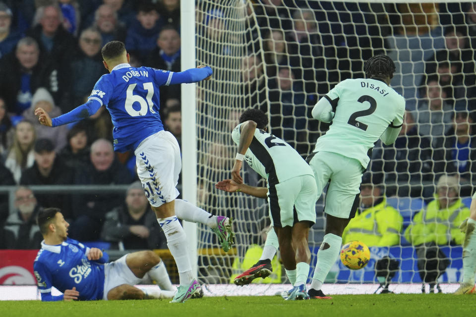 Everton's Lewis Dobbin, second left, scores his side's second goal during the English Premier League soccer match between Everton and Chelsea, at Goodison Park Stadium, in Liverpool, England, Sunday, Dec.10, 2023. (AP Photo/Jon Super)