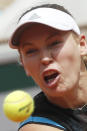 Denmark's Caroline Wozniacki plays a shot against Russia's Veronika Kudermetova during their first round match of the French Open tennis tournament at the Roland Garros stadium in Paris, Monday, May 27, 2019. (AP Photo/Pavel Golovkin)