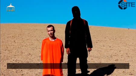 A still image taken from a purported Islamic State video released September 13, 2014 of British captive David Haines before he is beheaded. Mandatory credit REUTERS/SITE Intel Group via Reuters TV