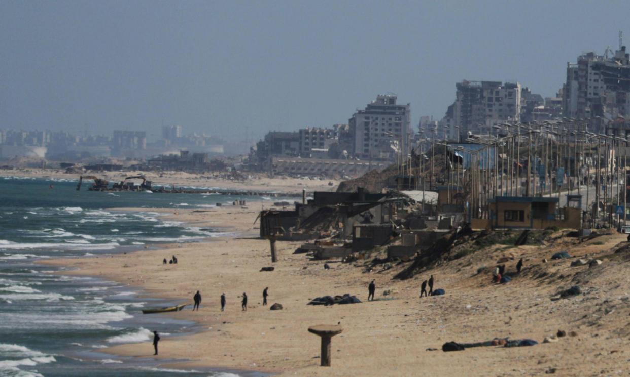 <span>Construction work on the Gaza City shore in preparation for a floating pier the US military is building at sea.</span><span>Photograph: Imago/Alamy</span>