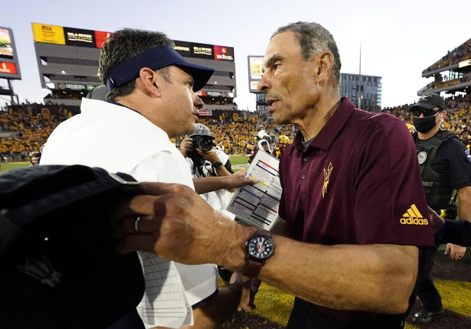 Nov 27, 2021; Tempe, Arizona, USA; Arizona Wildcats head coach Jedd Fisch greets Arizona State Sun Devils head coach Herm Edwards after ASU won the 95th Territorial Cup game at Sun Devil Stadium.