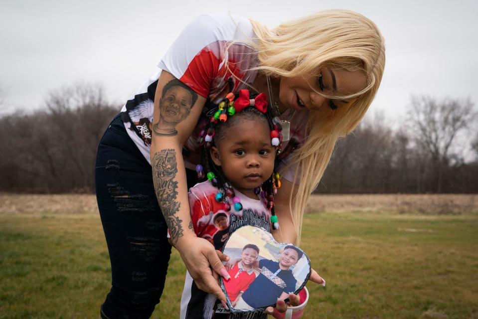 Crystal Cooper stands with her daughter Taylor Brown, 2, outside of their home in Swartz Creek, Thursday, Jan. 12, 2023. Cooper's two sons, Zy'Aire Mitchell, 12, and LaMar Mitchell, 9, died in a house fire last May after being trapped in a bedroom for more than six minutes following an all-clear issued by two Flint firefighters.