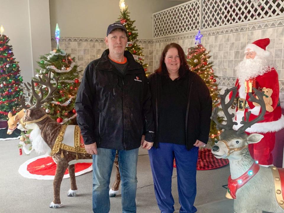 Randy and Tonya Carstensen’s Christmas display features several trees and animated reindeer.