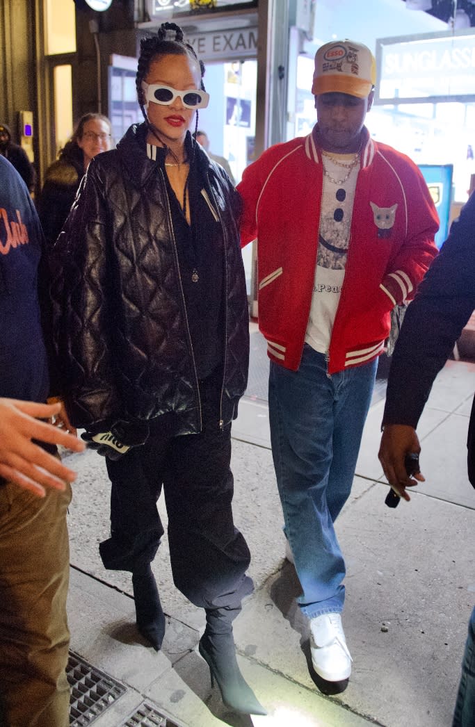 Rihanna and A$AP Rocky are spotted stepping out for a bit of shopping in NYC on Dec 3. - Credit: Splash