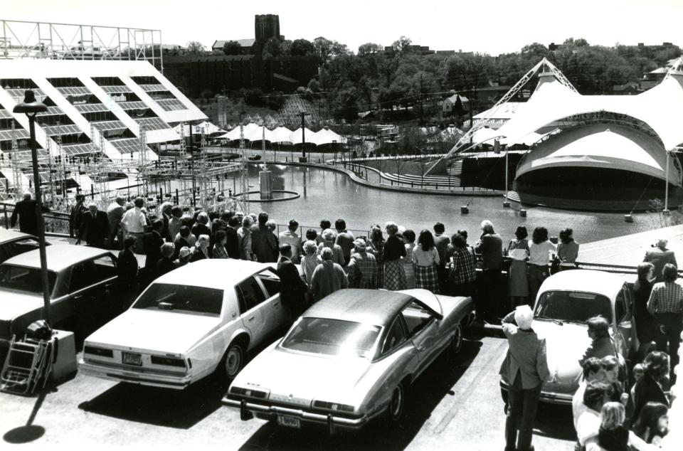Onlookers watch preparations at the site of the World's Fair in Knoxville in April 1982, the month before the fair opened. Despite the skeptical tone of a Wall Street Journal article that scorned "this scruffy little city" as an unlikely host for such an event, the fair was later deemed successful - and it left Knoxville with the iconic Sunsphere as a landmark and the "Scruffy City" nickname.