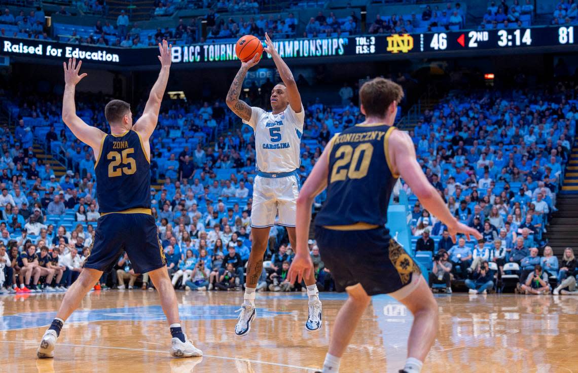 North Carolina’s Armando Bacot (5) launches the second of his three-point shots in the second half against Notre Dame. Bacot scored 14 points in the Tar Heels’ 84-51 victory over Noter Dame, in his final home game on Tuesday, March 5, 2023 at the Smith Center in Chapel Hill, N.C.