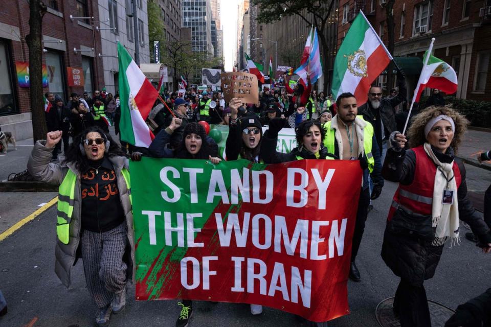 Protesters call on the United Nations to take action against the treatment of women in Iran during a demonstration in New York on Saturday (AFP via Getty Images)