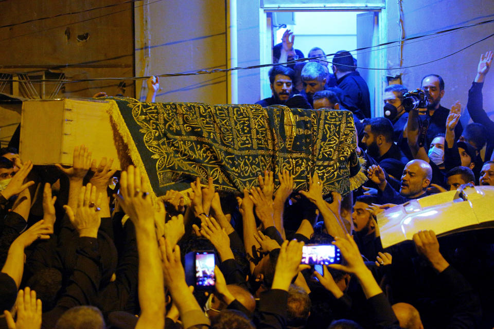 Mourners escort the coffin of Grand Ayatollah Sayyid Mohammed Saeed al-Hakim to his home in Najaf, Iraq, Friday, Sept. 3, 2021. Mohammed Saeed al-Hakim, one of Iraq's most senior and influential Muslim Shiite clerics, has died, members of his family said. He was 85. (AP Photo/Anmar Khalil)