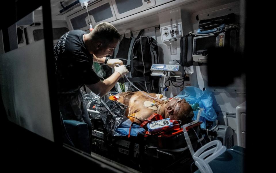 Healthcare workers treat a wounded local resident after a Russian missile strike in an apartment building, amid Russia's attack on Ukraine, in Pokrovsk, Donetsk region, Ukraine August 8, 2023