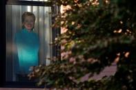 A photo of Democratic presidential candidate Hillary Clinton is seen on a window in the Carroll Gardens neighborhood of Brooklyn, New York, U.S., September 23, 2016. Picture taken September 23, 2016. REUTERS/Brendan McDermid