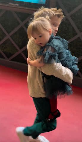 <p>Hilary Duff/Instagram</p> Luca Cruz carrying sister Mae James as seen in Duff's Instagram video.