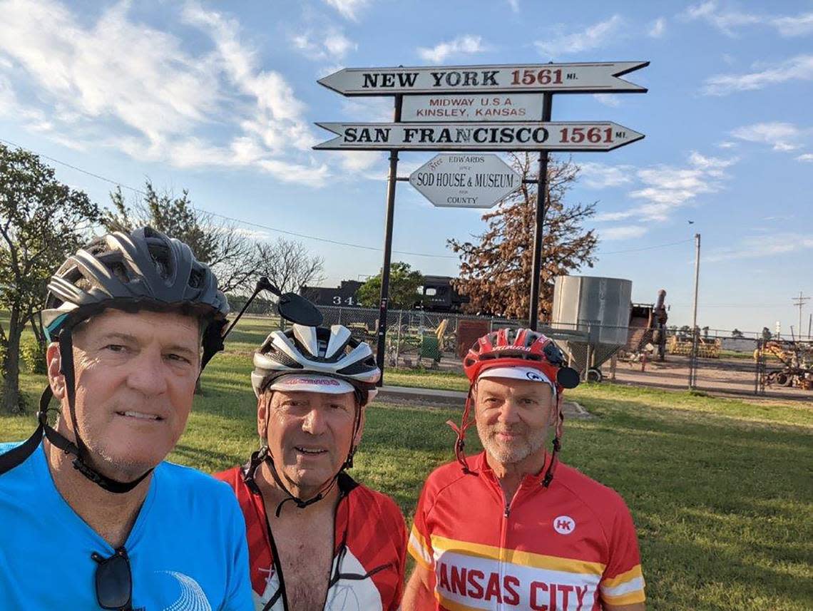 Monday-Biking across Kansas riders Matt Keenan, left, Marty Murphy, center, Denver, and Vince Hammeke, Lenexa, took a break in Kinsley, Kansas, the midway point between San Francisco and New York City.