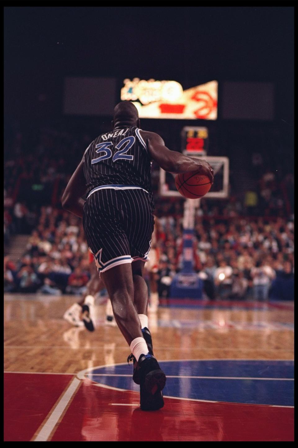 Shaquille O'Neal moves with the ball.