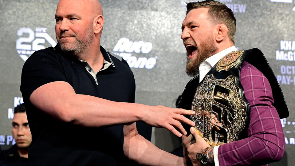 Conor McGregor is held back by UFC President Dana White during the UFC 229 Press Conference. (Photo by Steven Ryan/Getty Images)
