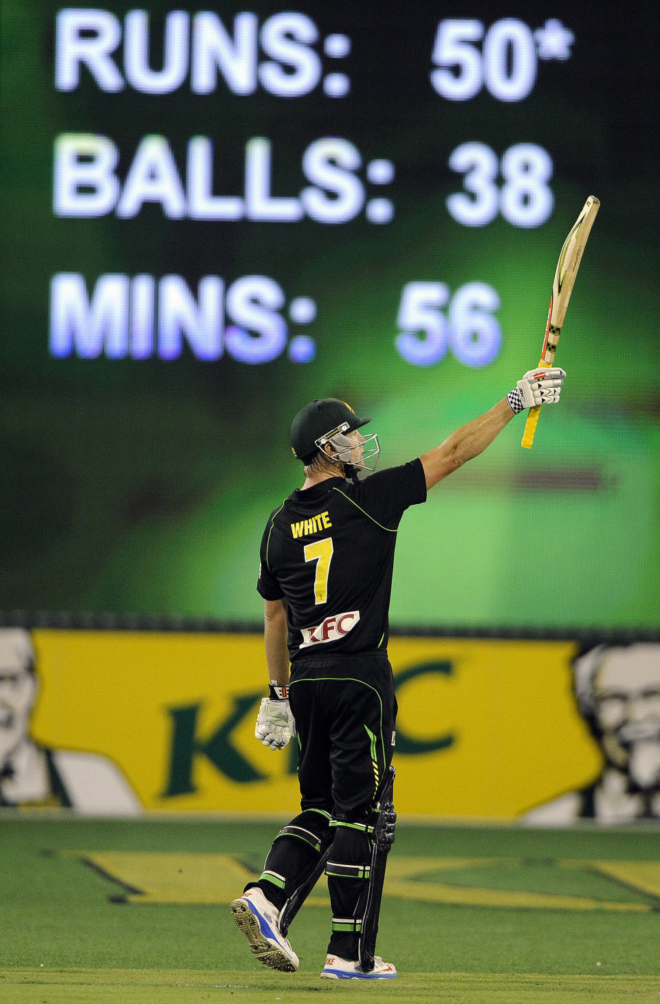 Australia's Cameron White celebrates after scoring 50 runs during the T20 International cricket match against England at the Melbourne Cricket Ground in Melbourne, Australia, Friday, Jan. 31, 2014. (AP Photo/Andy Brownbill)