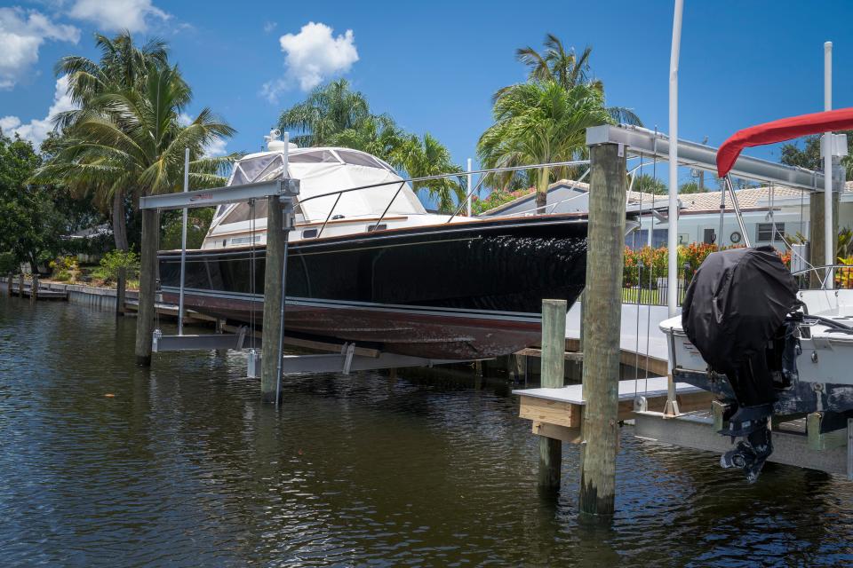 Homeowners were cited by county Code Enforcement for building a dock and a boatlift without a building permit in the Paradise Port community in Palm Beach Gardens.