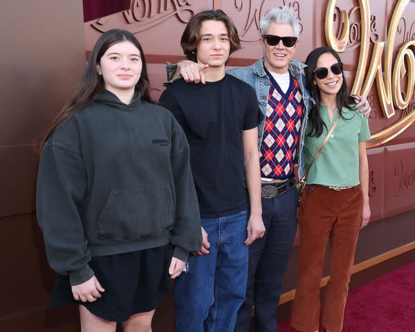 <p>Stewart Cook/Getty</p> Arlo Clapp, Rocko Akira Clapp, Johnny Knoxville and Emily Ting attend the Los Angeles Premiere of Warner Bros. "Wonka" at Regency Village Theatre on December 10, 2023