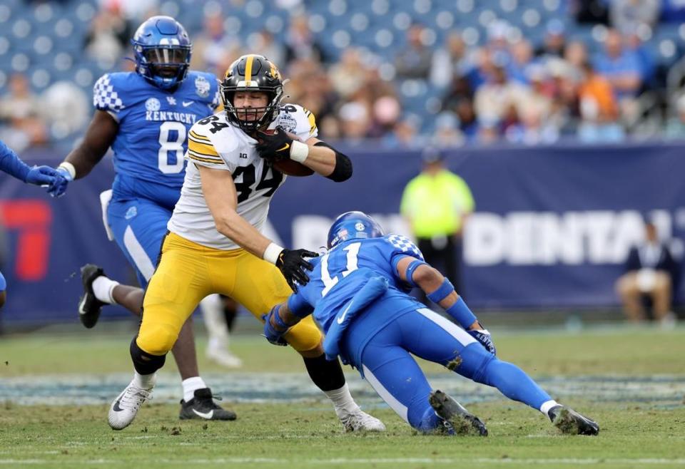 Iowa senior and Highland product Sam LaPorta heads upfield after hauling in a pass against Kentucky during the Music City Bowl on Dec. 31. LaPorta now is gearing up for the NFL draft.