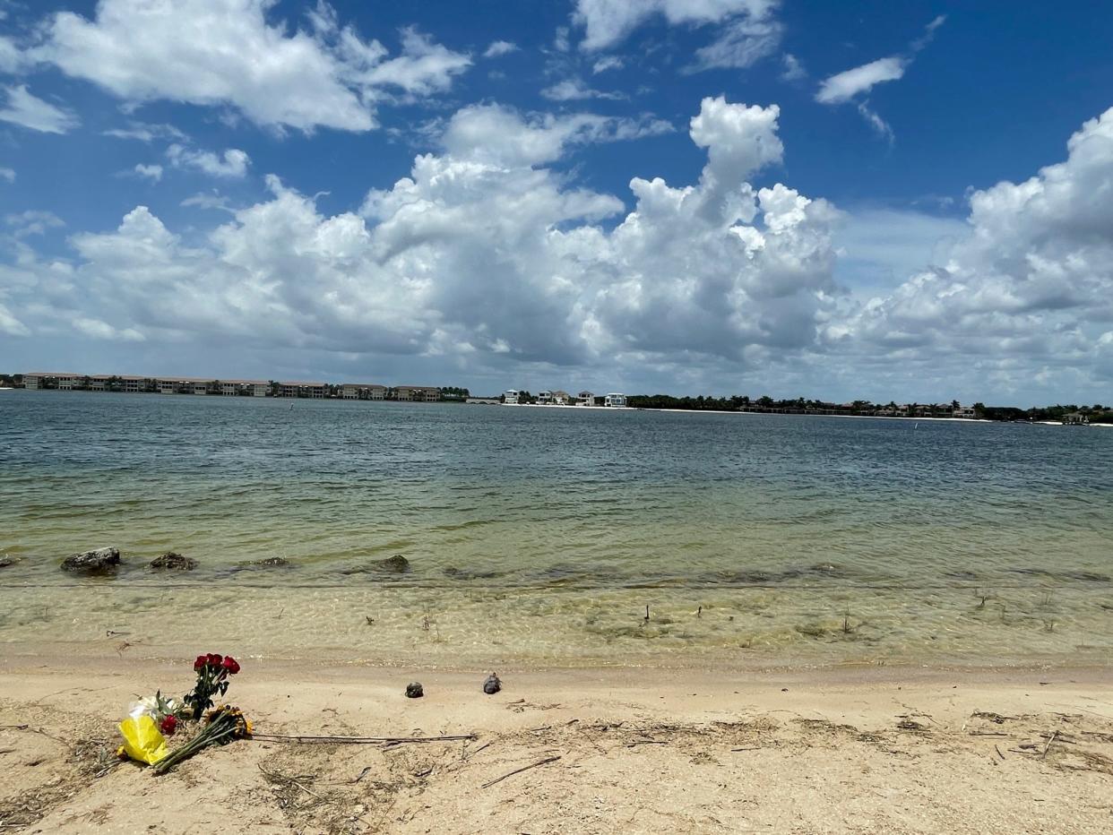 A small memorial has been placed on a beach at FGCU where two children 12 and under drowned Monday. A university statement said the beach is not intended for public use and there are no-swimming signs alerting to a sharp drop-off by the water's edge.