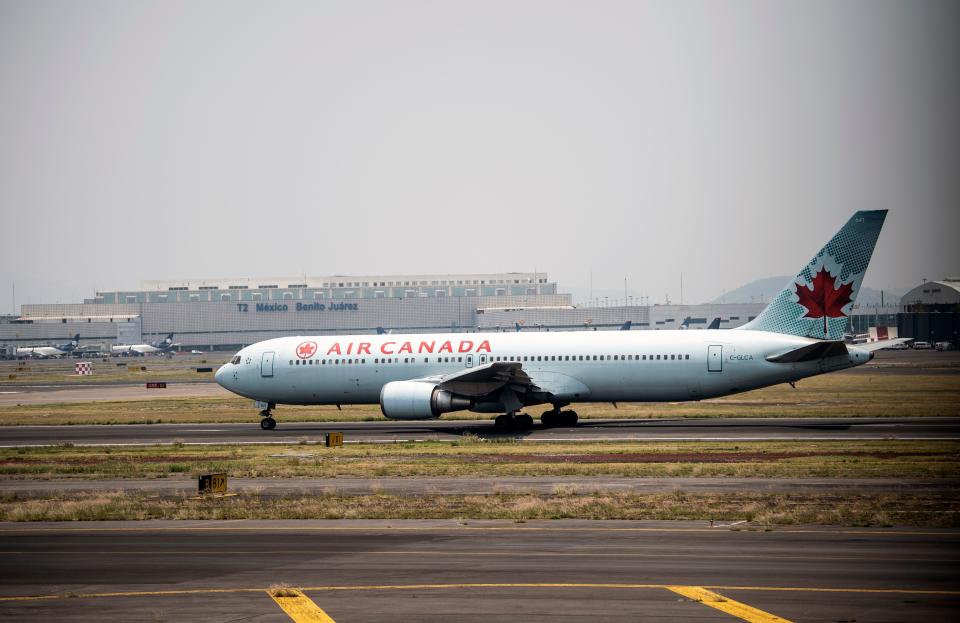 An Air Canada airlines plane prepares to take off at the Benito Juarez International airport, in Mexico City, on May 20, 2020, amid the new Covid-19 coronavirus pandemic. - From suspending all flights to reducing their employees' wages, Latin American airlines take extreme measures and cry for government aid in the face of the expansion of the coronavirus, which could leave them losses of 15,000 million dollars this year. (Photo by PEDRO PARDO / AFP) (Photo by PEDRO PARDO/AFP via Getty Images)