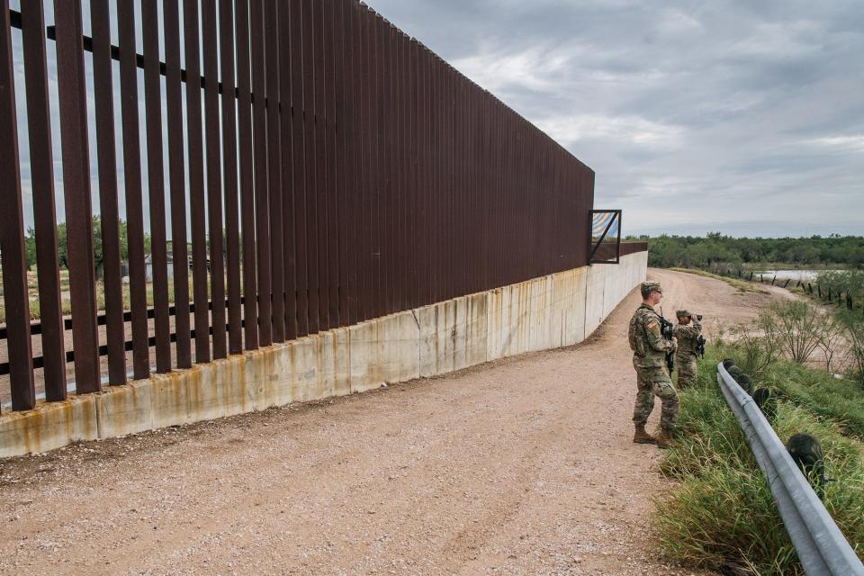 National Guard members patrol near an unfinished section of border wall on Nov. 18, 2021 in La Joya, Texas. More than 10,000 Guard members have been deployed to the U.S.-Mexico border to assist in border enforcement as part of Operation Lone Star.