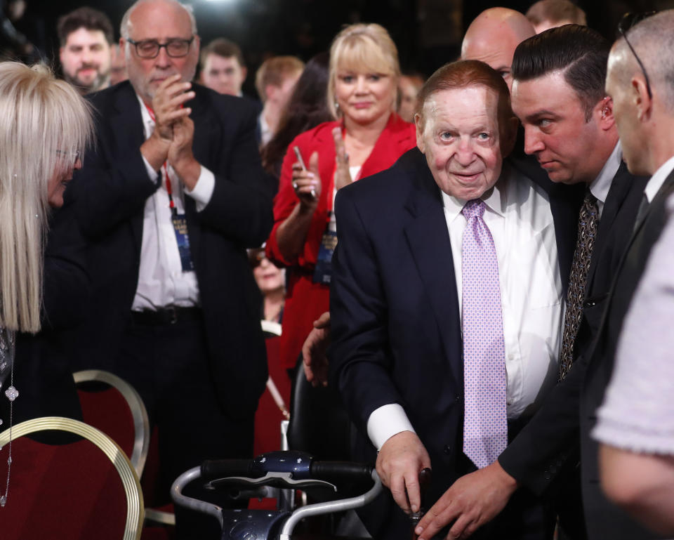 Republican megadonor Sheldon Adelson, center, arrives to hear President Donald Trump speak at the Republican Jewish Coalition's annual leadership meeting, Saturday April 6, 2019, in Las Vegas. (AP Photo/Jacquelyn Martin)