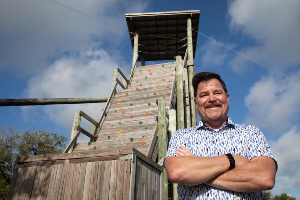 Kurt Podeszwa, president and CEO of Camp Aranzazu, stands in front of the incline obstacle of the camp's challenge course on Wednesday, July 12, 2023, in Rockport, Texas.