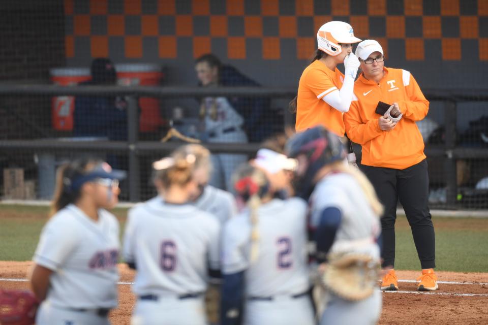 Volunteer assistant Coach Kate Malveaux listens to a player during a Lady Vols softball game between Tennessee and Ole Miss at Sherri Parker Lee Stadium, Friday, March 10, 2023.